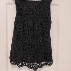Sleeveless black lace top.